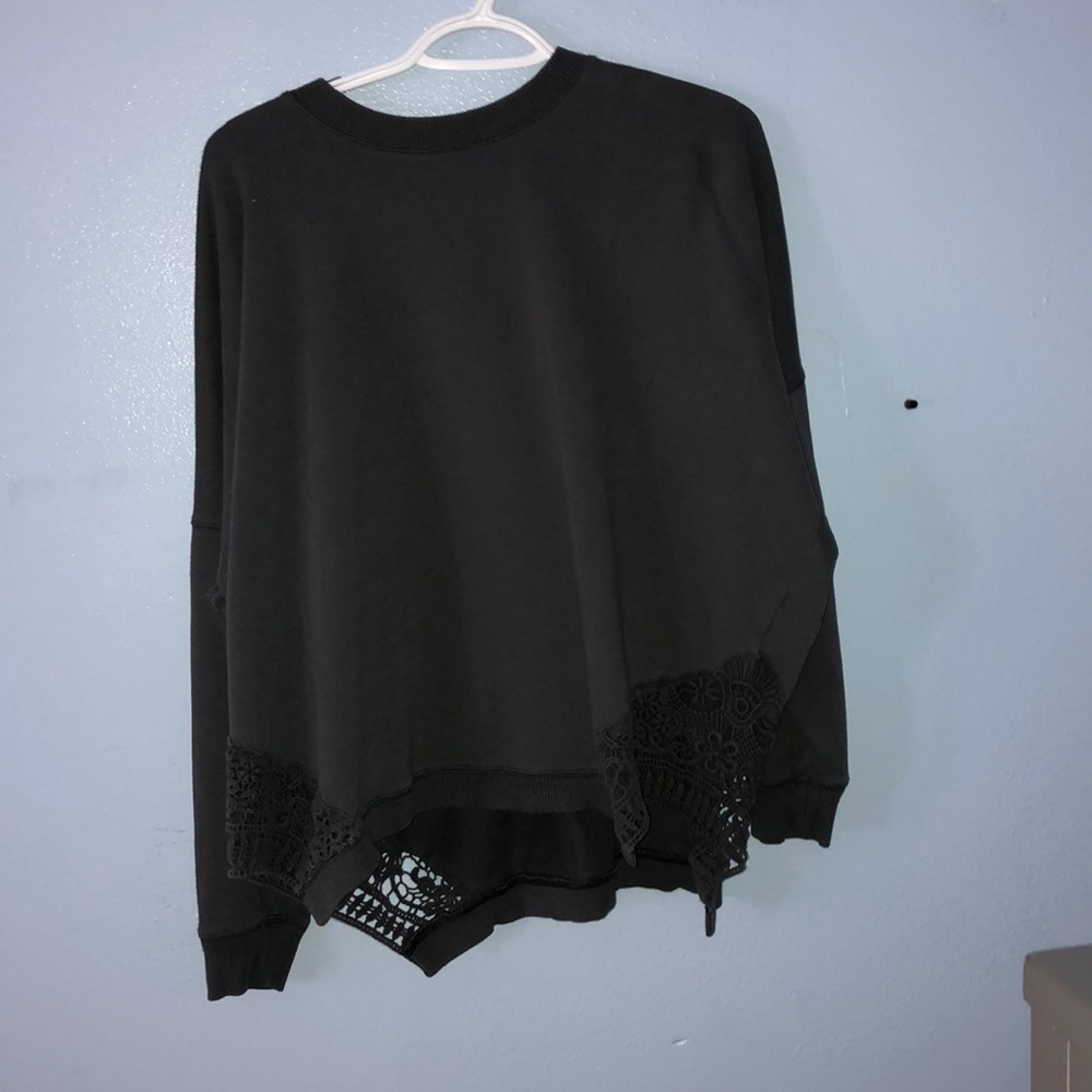 This is a dark gray sweater.